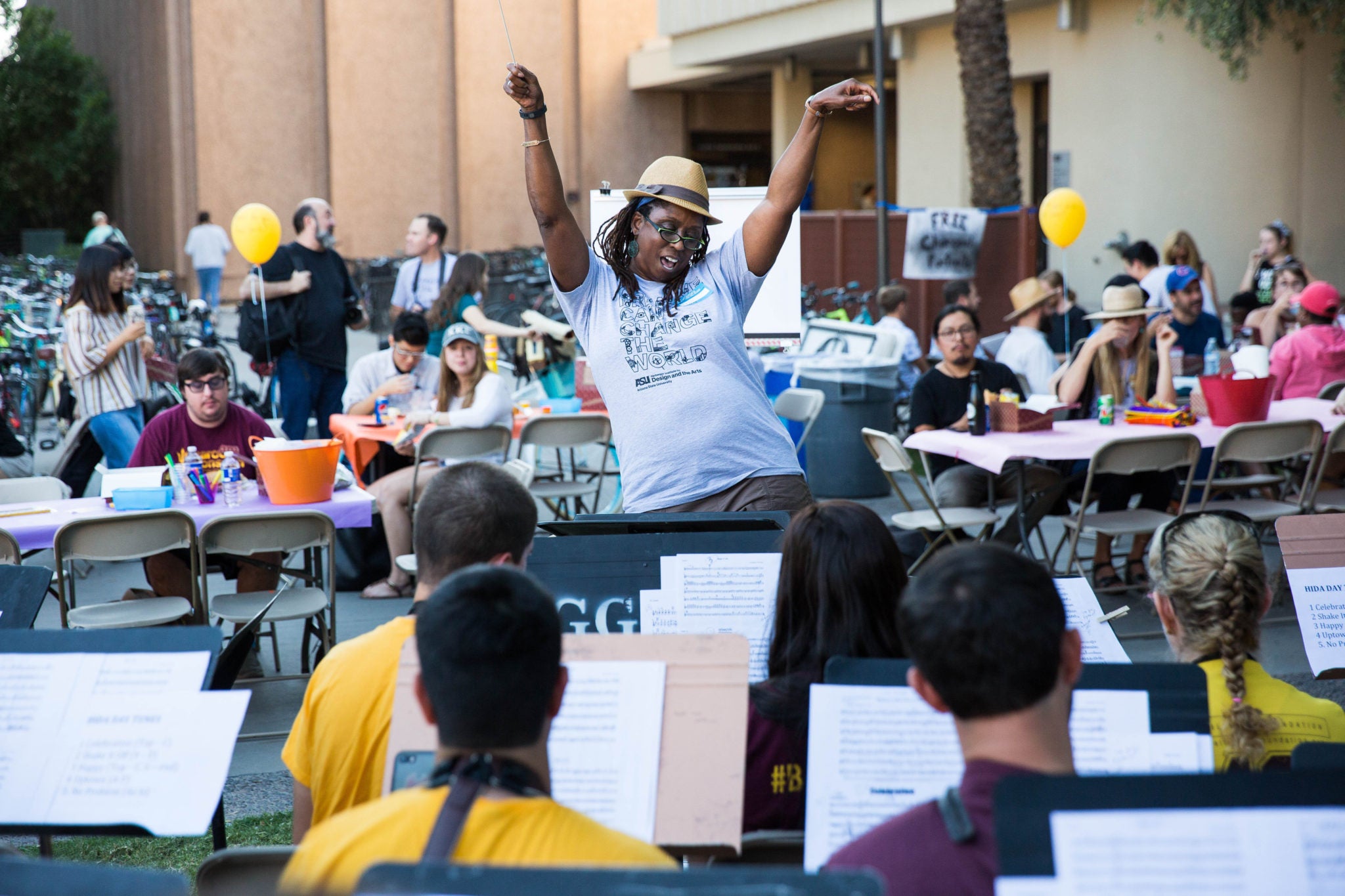 Associate professor of music therapy Melita Belgrave takes a turn 'conducting, ' the School of Music's Wind Ensemble at Herberger Institute Day