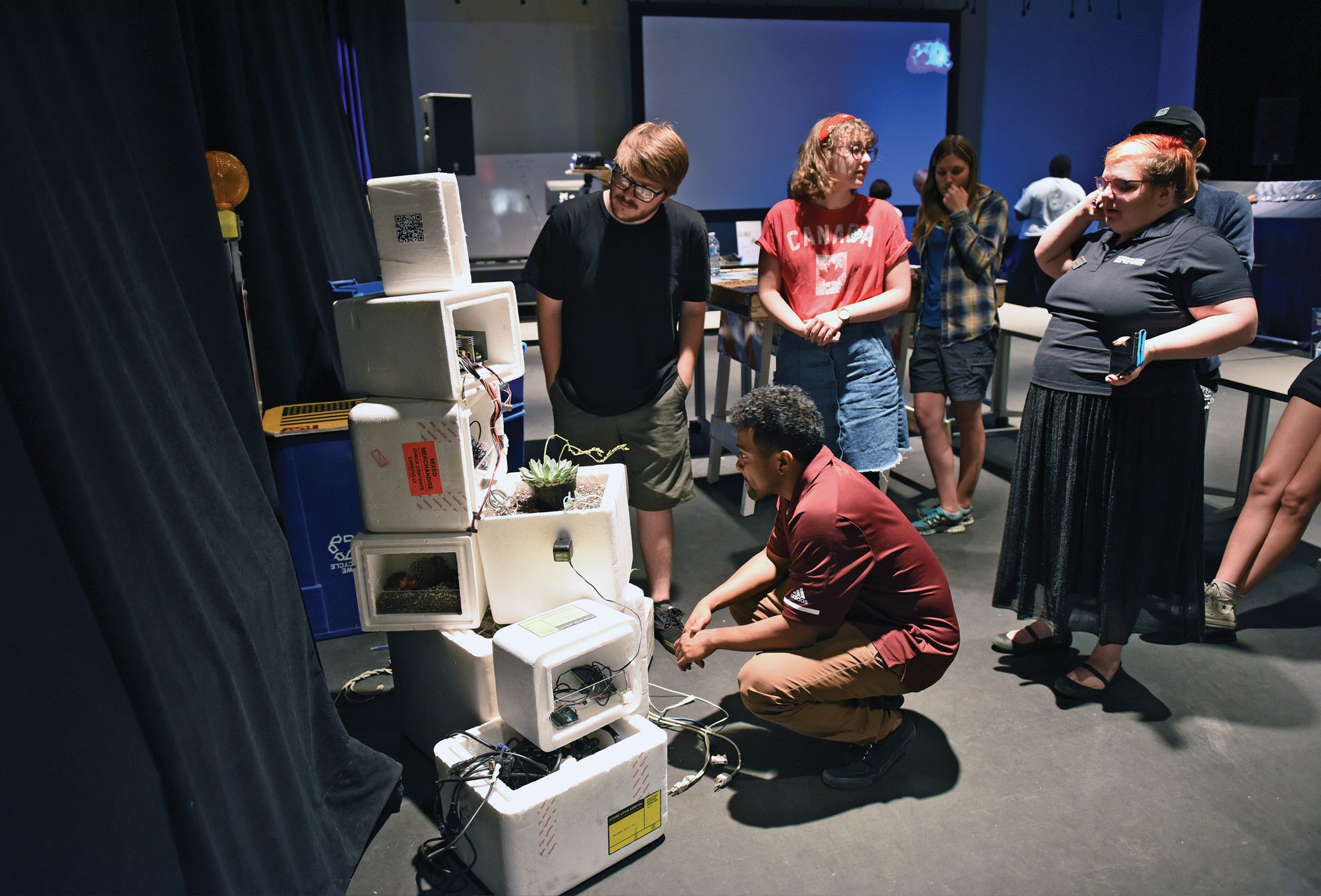 Students looking at installation at Digital Showcase