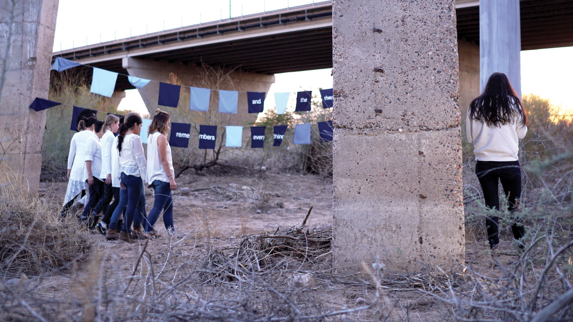 Group of women walking through desert