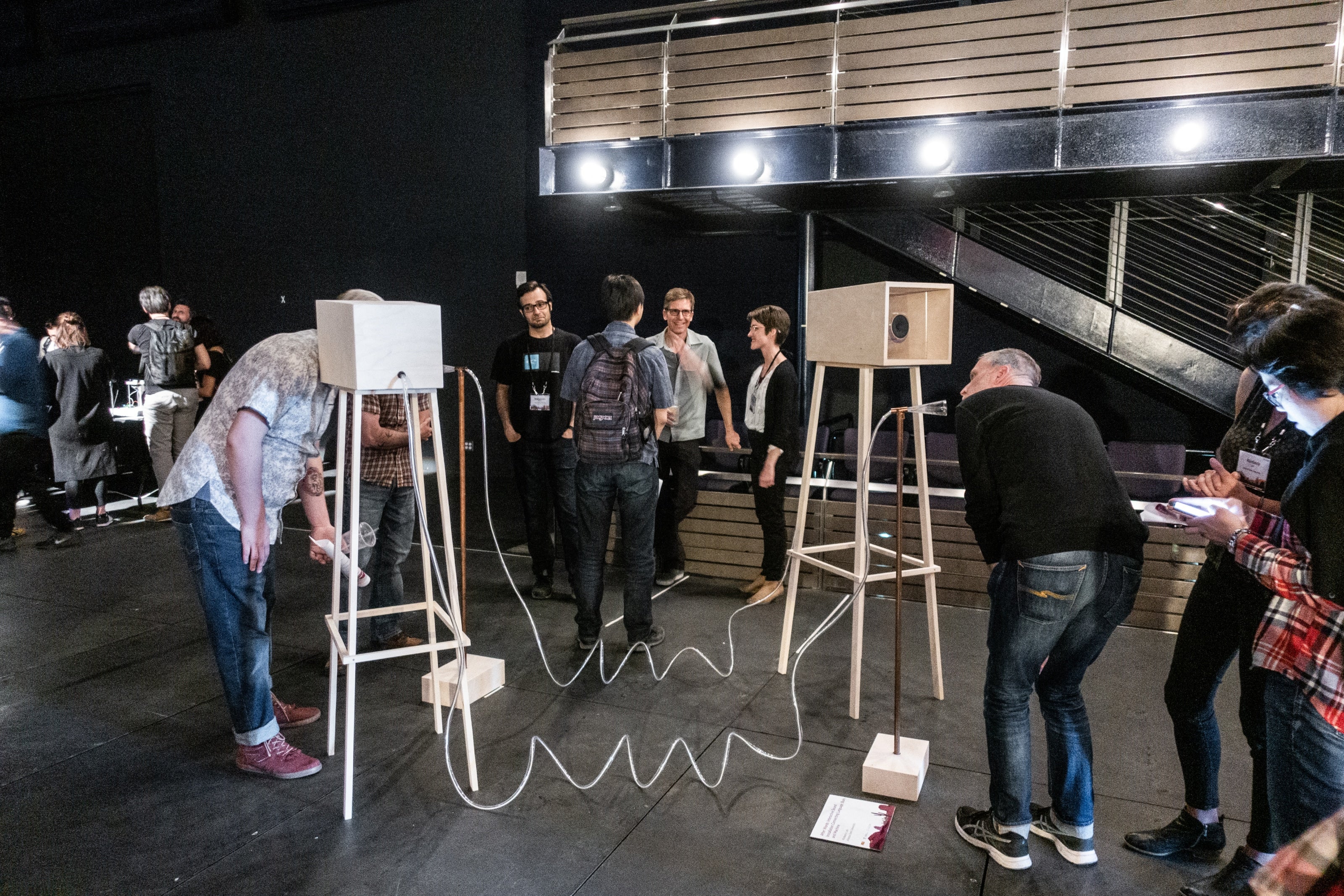 two men interact with "After Words" sound installation